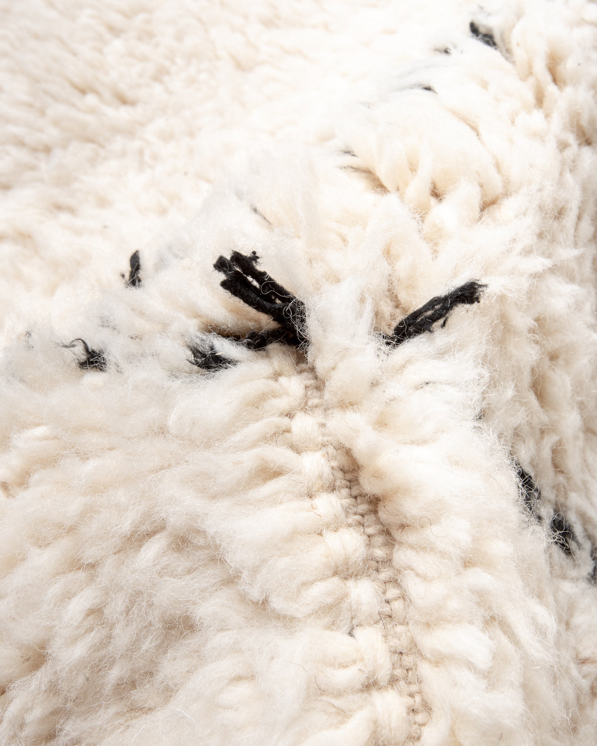 Modern, designer, handcrafted Berber rug from Morocco. Beniourain carpet with minimalist design, natural wool pile and a fluffy texture.